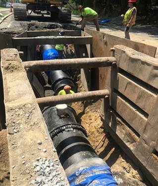 Installing pipe on Dedham Boulevard